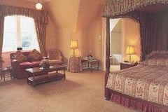 Deluxe bedroom with four poster bed